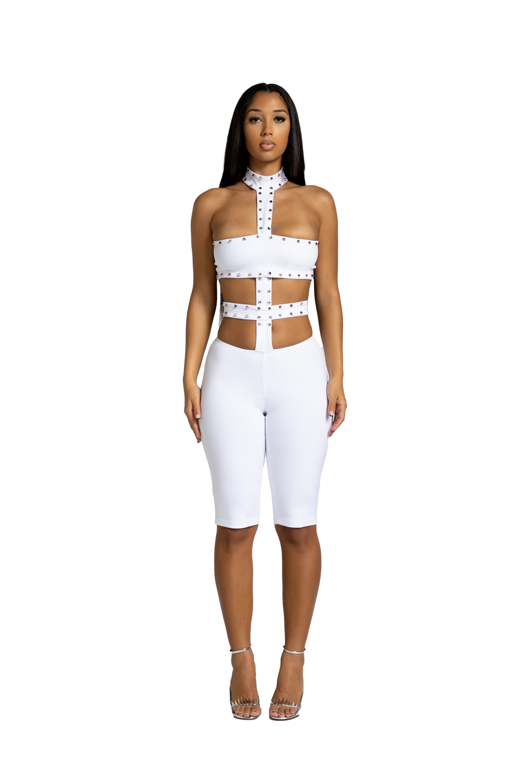 Front view of white studded cutout jumpsuit with fitted silhouette