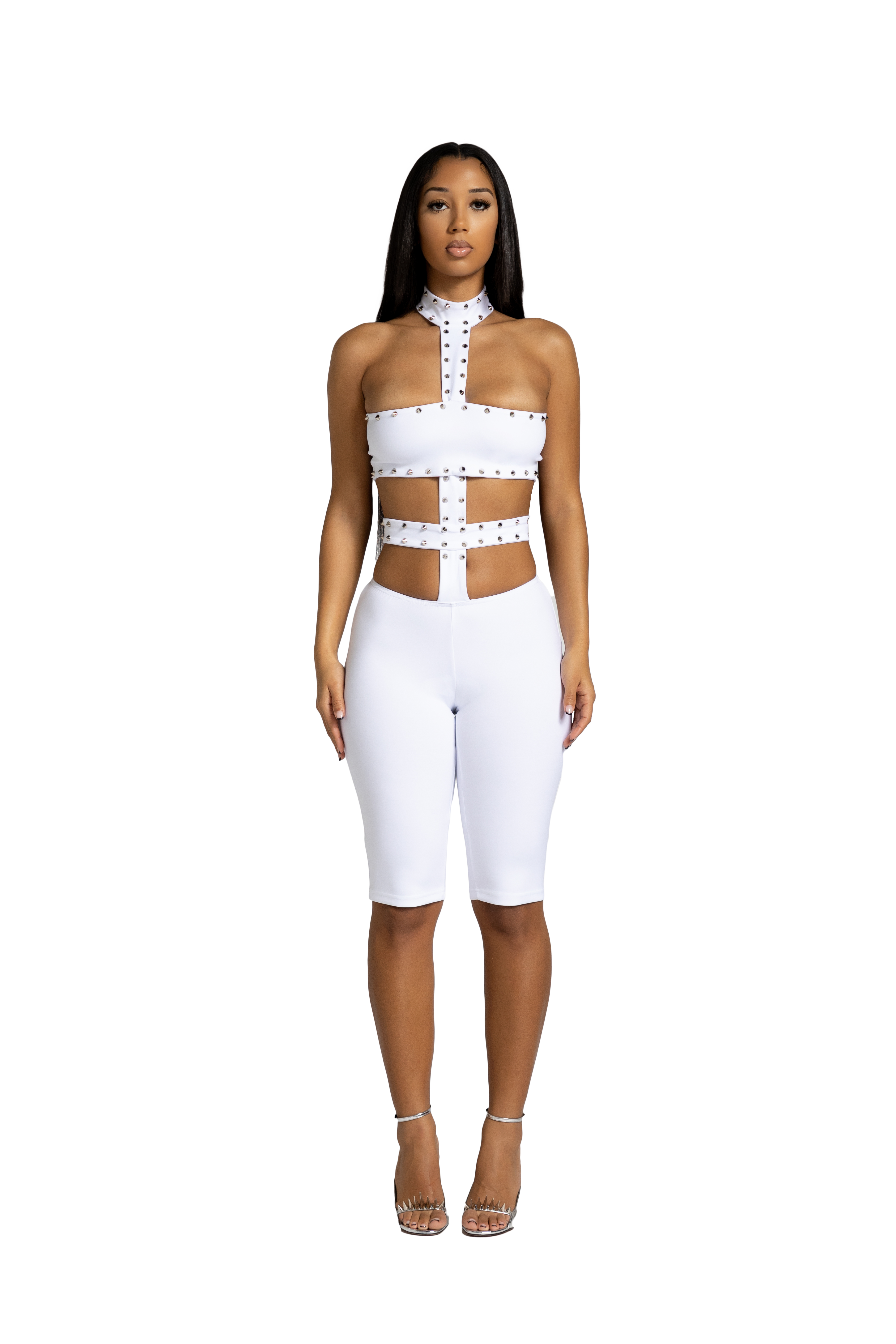 Front view of white studded cutout jumpsuit with fitted silhouette