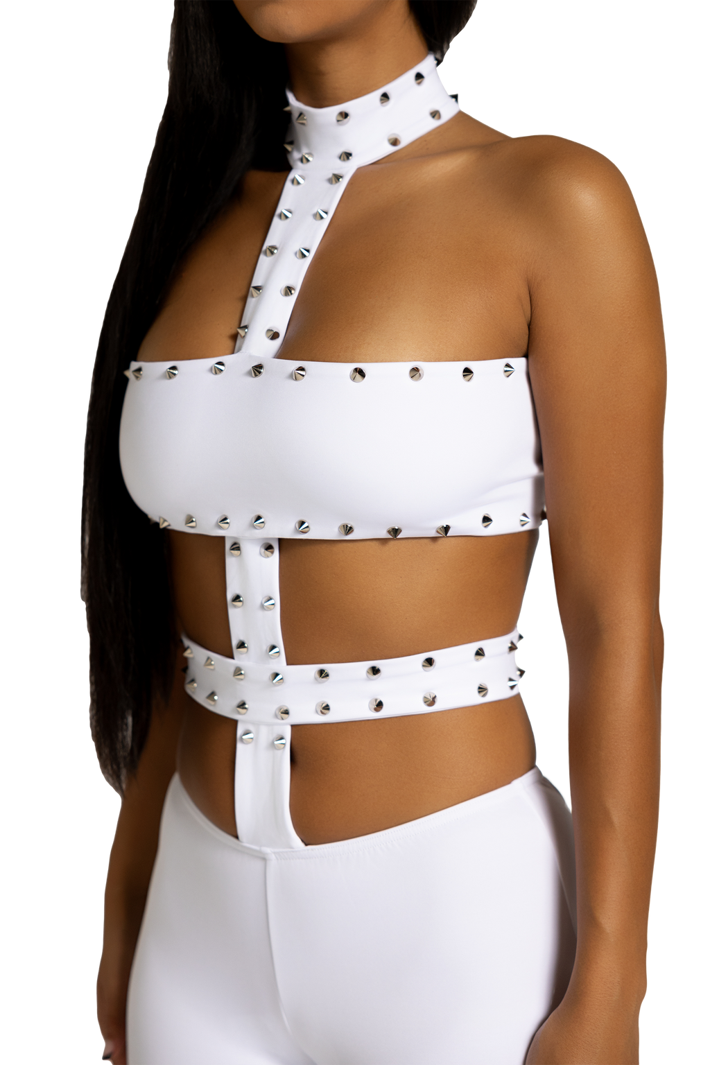 Side view of white studded cutout jumpsuit with fitted silhouette